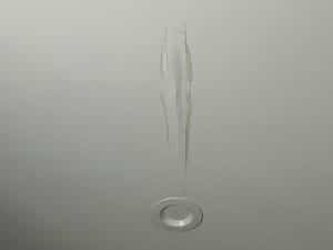 Picture of a white ceiling with a stain that is clearly from a leaking roof above.