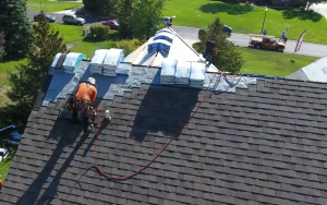 GoTo Roofing employee installing a roof