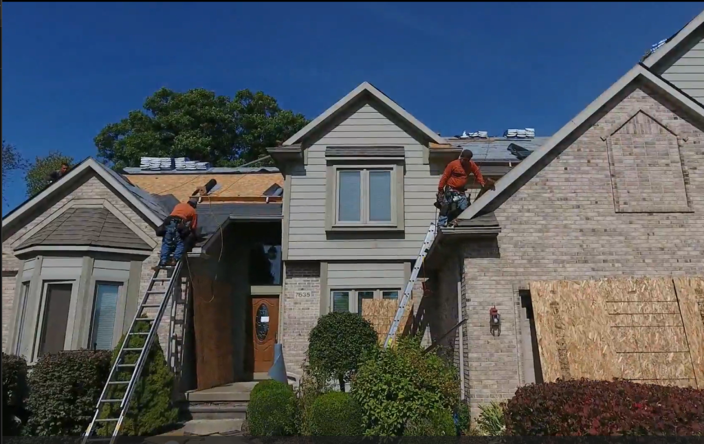 men working on a roof