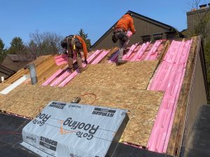 men working on a roof